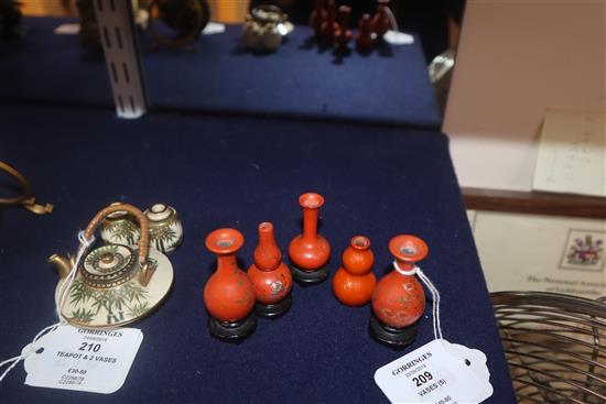 A group of four Chinese lacquer wood miniature vases and a similar pottery double gourd vase (5)